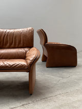 COGNAC LEATHER SEATING GROUP ARMCHAIR SOFA OTTOMAN IM THE STYLE OF DE SEDE, 1980s