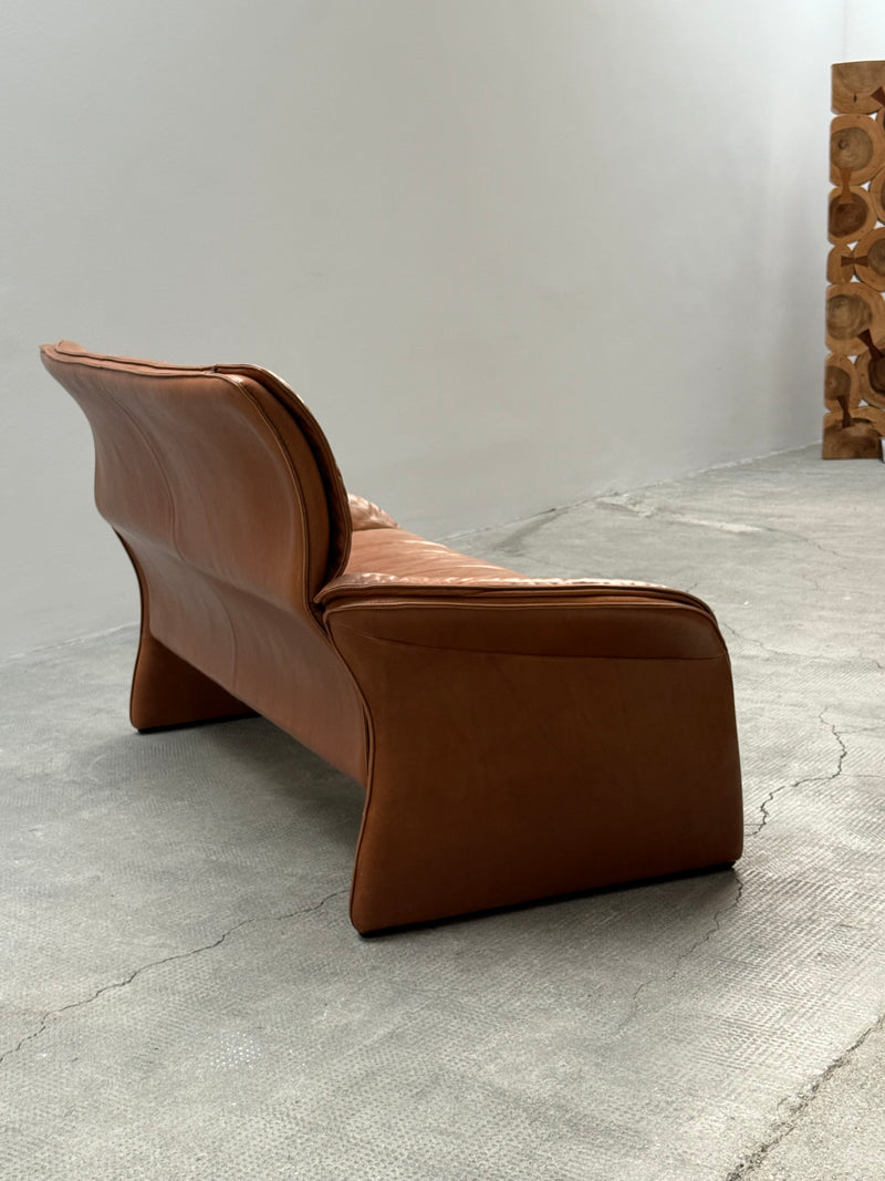 COGNAC LEATHER SEATING GROUP ARMCHAIR SOFA OTTOMAN IM THE STYLE OF DE SEDE, 1980s