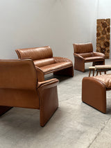 COGNAC LEATHER SEATING GROUP ARMCHAIR SOFA OTTOMAN IM THE STYLE OF DE SEDE, 1980s