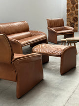 COGNAC LEATHER SEATING GROUP ARMCHAIR SOFA OTTOMAN IM THE STYLE OF DE SEDE, 1980s